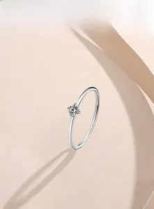 Macro shot of S925 sterling silver minimalist ring with 1mm band and single cubic zirconia
