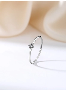 Macro shot of S925 sterling silver ring showing the inner stamp and 4-claw cubic zirconia