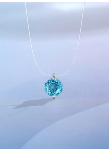 Detailed close-up of an octagonal rose-cut aquamarine pendant with a fine silver chain