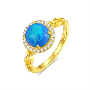 Elegant gold S925 silver ring featuring a blue round opal stone with a halo of white gems