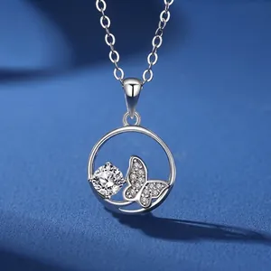 Detailed close-up of S925 silver necklace with round hollow pendant and diamond butterfly