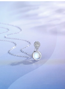 Macro shot of S925 silver necklace with moonstone pendant and micro-inlaid zircons