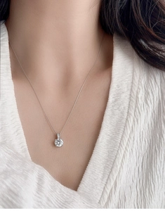 Close-up of S925 sterling silver necklace with a 2-carat sparkling diamond pendant for women