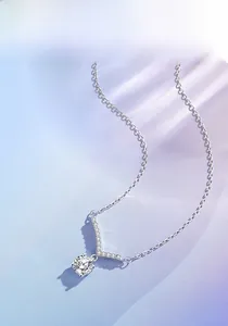 Close-up of 925 sterling silver V-shaped pendant necklace with moissanite stones