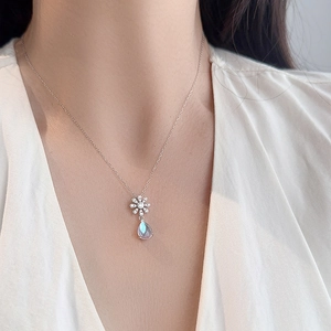 S925 silver daisy necklace with teardrop moonstone and shimmering cubic zirconia crystals