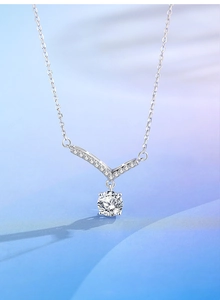 Macro shot of 925 silver V-shaped necklace with moissanite pendant and four-prong setting