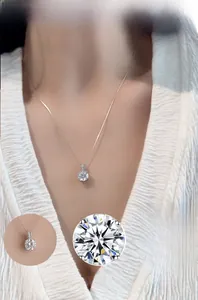 Close-up of S925 silver necklace with 4-prong moissanite pendant and sparkling chain
