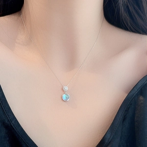 S925 sterling silver necklace featuring moonstone heart pendant on model