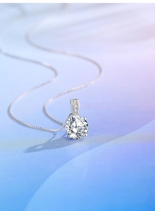 Macro shot of S925 sterling silver necklace with 2ct round cut diamond pendant