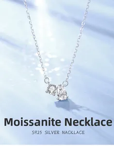 Macro detail of S925 sterling silver necklace featuring round and pear-cut moissanite stones