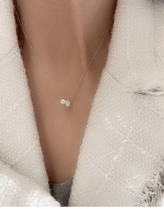 Elegant S925 sterling silver necklace with pear and round cut moissanite pendant on model