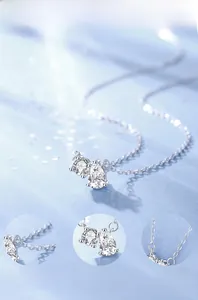 Detail of S925 sterling silver moissanite necklace with water drop and round pendants