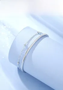 Detail of S925 sterling silver double-layer bracelet with polished beads and zircon stones