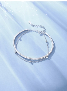 Detail of S925 sterling silver double-layer bracelet with beads and zircon inlay