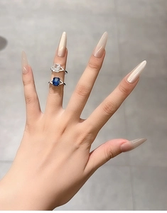 Detailed view of S925 silver rings with royal blue sapphire and radiant cut cubic zirconia