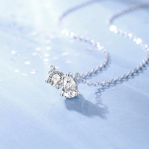 S925 Sterling silver necklace featuring round and pear cut moissanite pendant in silver