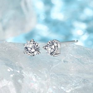 Sparkling 925 silver stud earrings with 3-prong round moissanite on crystal ice base