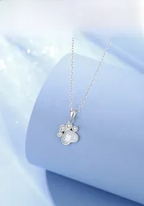 Close-up of S925 silver cat paw necklace with heart-shaped white chalcedony stone