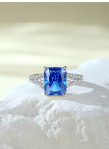 Macro shot of S925 sterling silver ring featuring a radiant cut royal blue sapphire gem