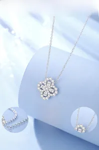 Macro detail of S925 sterling silver four-leaf clover necklace with cubic zirconia pavé
