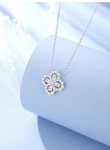 Close-up of S925 sterling silver four-leaf clover necklace with sparkling zircon pavé