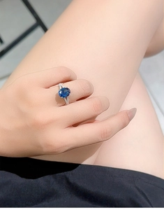 Close-up of S925 silver ring with radiant cut royal blue sapphire and pavé diamonds