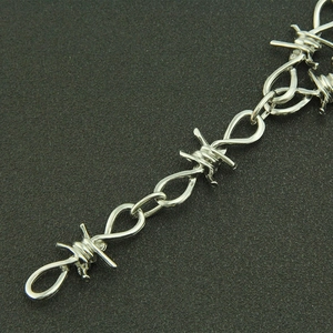 Punk style silver thorn chain necklace with multi-layer barbed wire design for street fashion