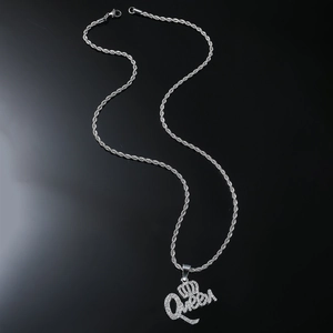 Detail of silver Queen pendant with iced out rhinestones on a rope chain necklace