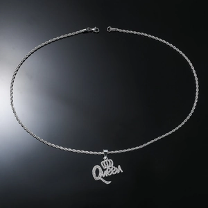 Detailed view of silver Queen letter pendant with crown and iced out rhinestones on rope chain