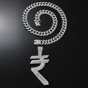 Macro shot of silver hip-hop necklace with iced-out Rupee symbol pendant and Cuban link chain