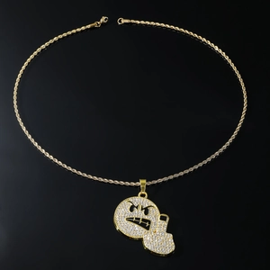 Detailed close-up of hip hop rope chain and iced out emoji middle finger pendant