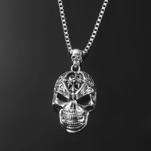 Realistic silver skull pendant necklace with intricate cross engraving and long box chain