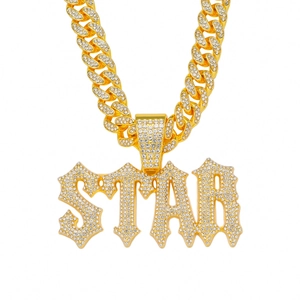 Detailed macro view of the gold plated STAR pendant with shimmering white rhinestones
