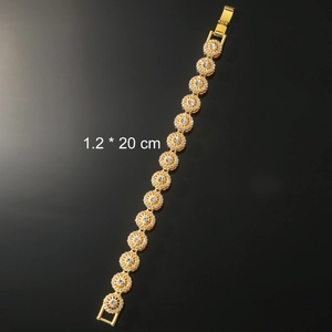 Detail of a 1.2x20 cm gold flower hip hop bracelet with white zircon and folding clasp