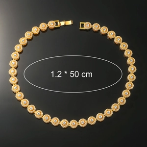Detailed macro view of 1.2cm wide gold hip-hop necklace with full crystal paving