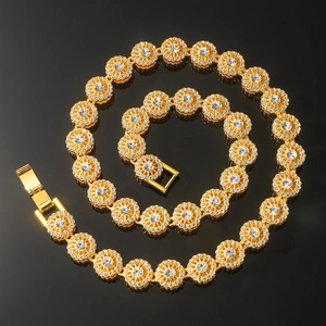 Macro detail of gold-plated iced out necklace with round links and cubic zirconia stones