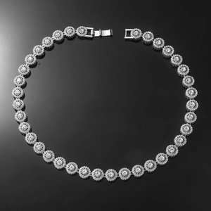 Macro view of iced out silver cuban link chain with sparkling diamond-set round links