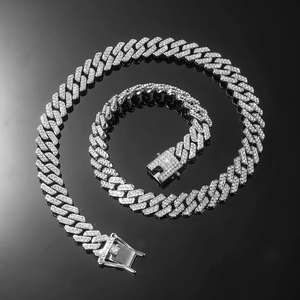 Macro detail of silver Cuban link chain set with sparkling cubic zirconia pavé setting