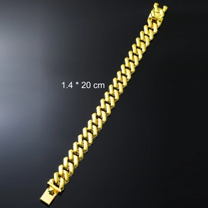 Detail view of 14mm wide gold Cuban link bracelet with 20cm length and secure folding clasp