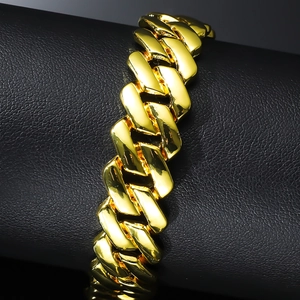 Men's hip hop gold cuban link bracelet with high polished finish on black leather stand