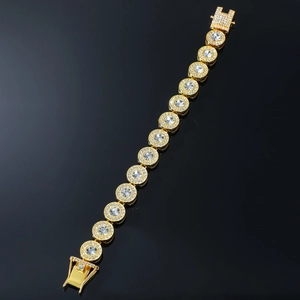 Detail view of a gold-plated hip-hop tennis bracelet with large zircon stones and micro-pave