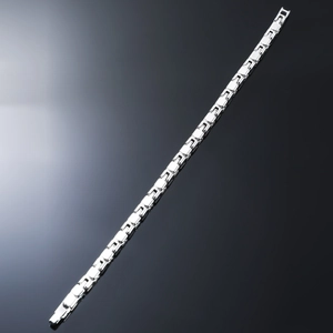 Detailed view of polished silver geometric links on a sleek industrial style bracelet