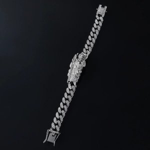 Close-up of hip hop silver Cuban bracelet with angel figure and sparkling diamonds