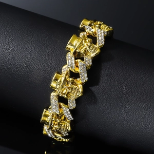 Hip hop gold Cuban chain bracelet featuring skull elements with sparkling rhinestones