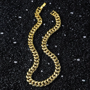 Men's 12mm gold Cuban link chain necklace displayed on a luxury textured black background