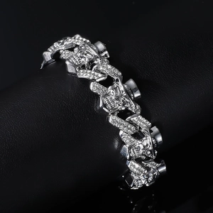 Macro shot of silver punk skull bracelet with sparkling rhinestones on black leather