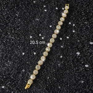 Macro detail of 10mm gold iced-out tennis bracelet showing 20.5cm length and round crystals