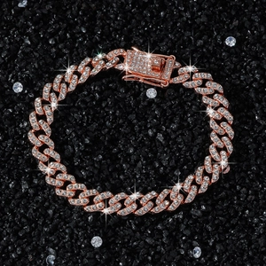 9mm rose gold cuban chain bracelet with white pavé zircons on black stone background