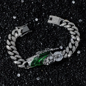 Hip hop cuban link bracelet with iced out San Judas pendant and green enamel details