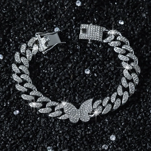 Hip hop butterfly cuban link bracelet with white rhinestones on black stone background